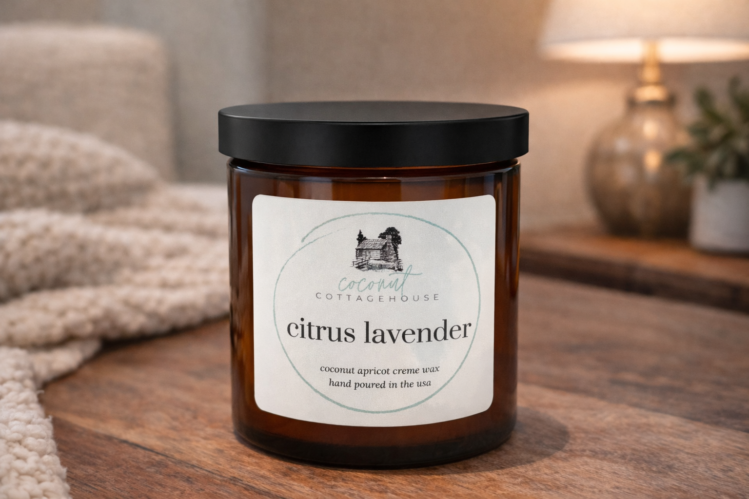 A brown glass jar with a black lid, labeled "Citrus Lavender" and "Coconut Cream Wax Hand Poured in the USA", sits on a wooden surface.
