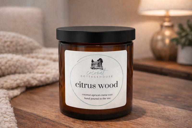 A brown glass jar with a label that reads "Citrus Wood" and "Citrus Apricot Crème wax hand poured in theUSA".
